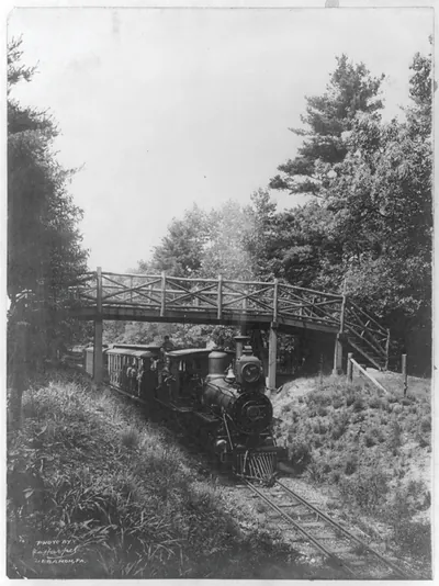 [Railroad train passing under bridge, with the locomotive in foregrd., near Lebanon, Pa. (?)