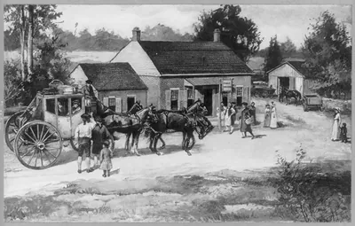 People, horses and stagecoach in front of the Eagle Tavern