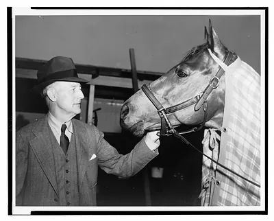 [Charles S. Howard admiring his horse Seabiscuit, after the horse's victory in the Santa Anita Handicap]