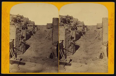 Stereoview of an adobe pueblo street with ladders