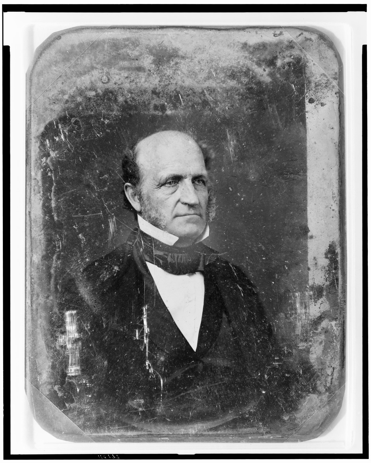 Daguerreotype portrait of a balding man in a dark suit, 1844 — historic photograph