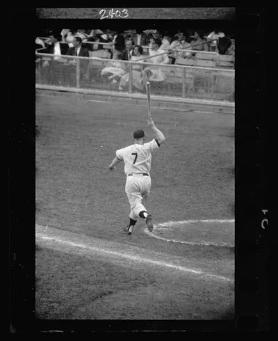 [Rear view of New York Yankee baseball player Mickey Mantle with bat swung up in air] / Marvin E. Newman.