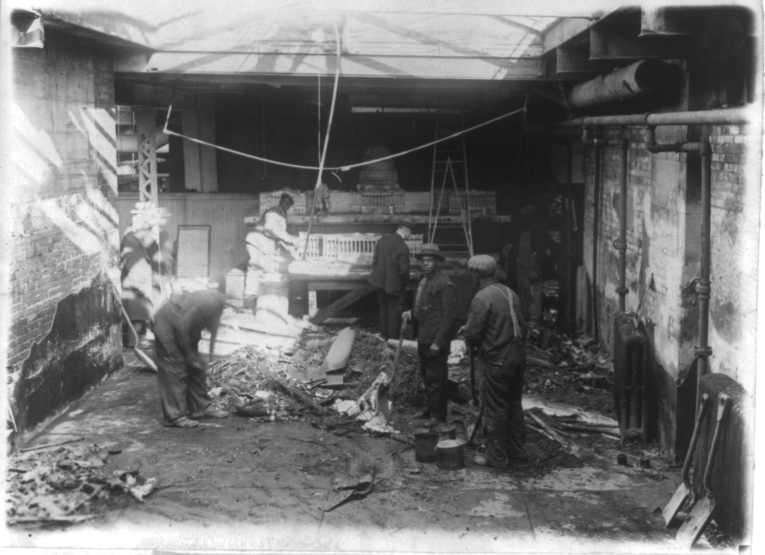 Scene in the studio of Charles E. Moberley at the U.S. Capitol, Where most of last night's fire was confined, 1930 Jan. 4. — historic photograph