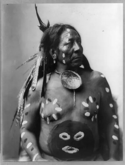 [Last Horse, half-length portrait, facing right; wearing body paint and feathers in his hair]