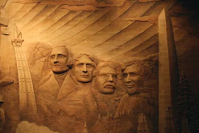 Carved relief of Mount Rushmore presidents' faces