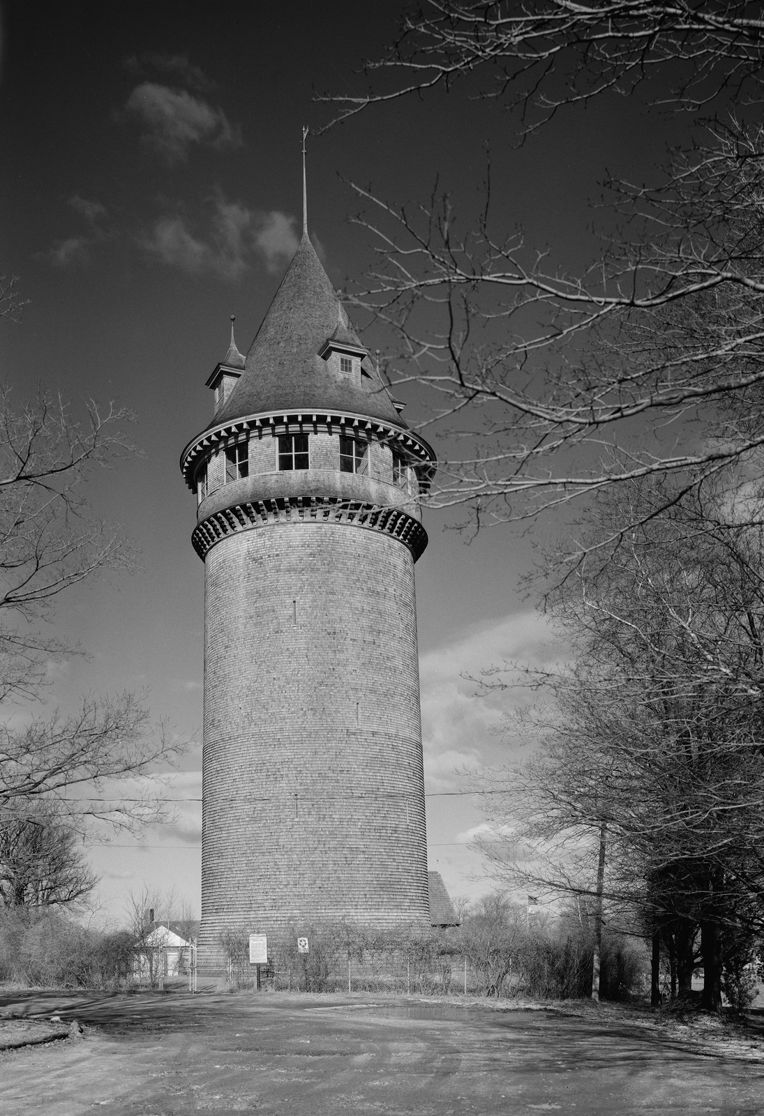 Shingled water tower with cupola, black and white photograph — historic photograph