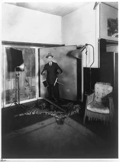 Herbert E. French, proprietor of the National Photo Co., posed in his Washington, D.C. studio