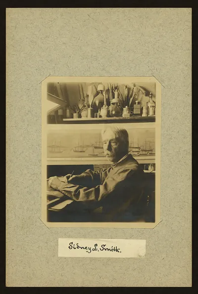 Sidney L. Smith, half-length portrait seated at desk