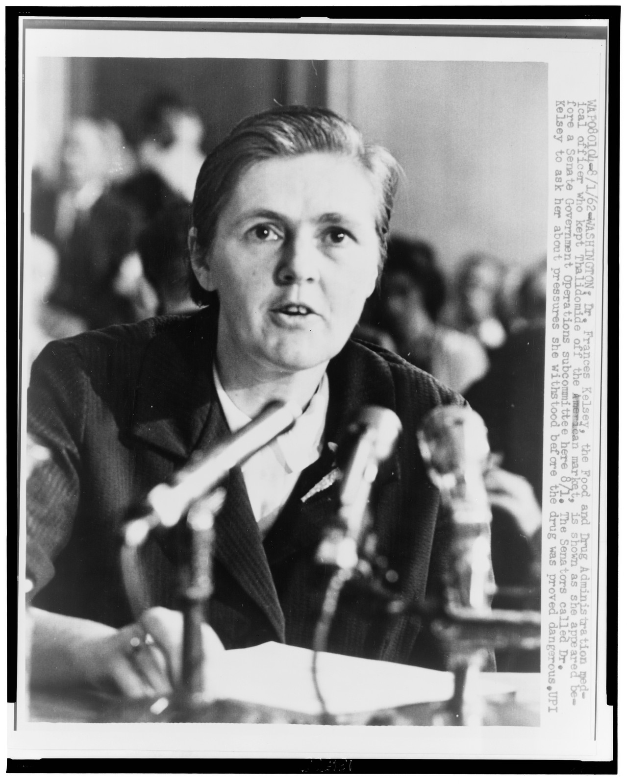 [Dr. Frances O. Kelsey, head-and-shoulders portrait, facing front, addressing the Senate Government Operations subcommittee concerning Thalidomide], 1962 August 1. — historic photograph