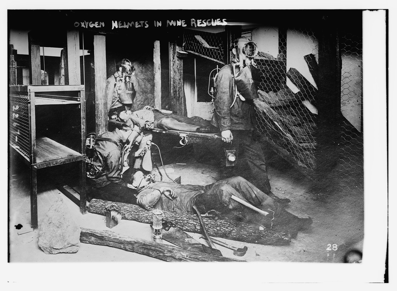 Oxygen helmets in mine rescues, n/a — historic photograph