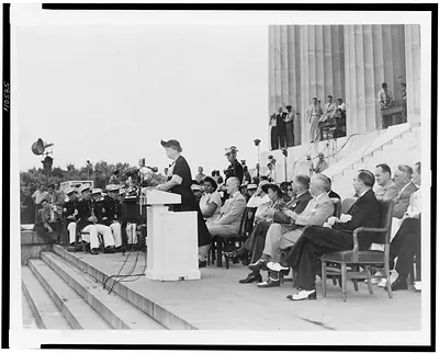 Mrs. Eleanor Roosevelt addressing the closing session of the 38th annual conference of the National Association for the Advancement of Colored People from the steps of the Lincoln Memorial in Washington, D.C. / The Scurlock Studio, Washington, D.C.