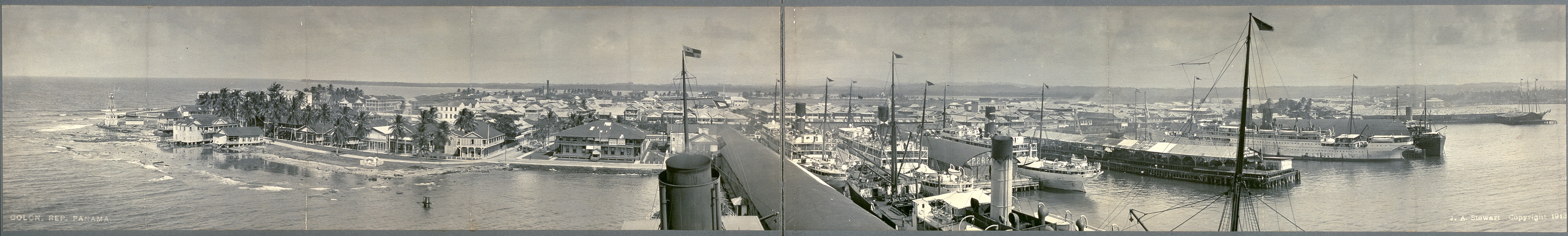 Panoramic view of a harbor town with steamships — historic image