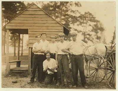 Gang of older boys working in White's Bog Brown Mills, N.J. Cranberry bogs, a rough gang. Sept. 28, 1910. Witness, E. F. Brown,. Location: Browns Mills, New Jersey / Photo by Lewis W. Hine.