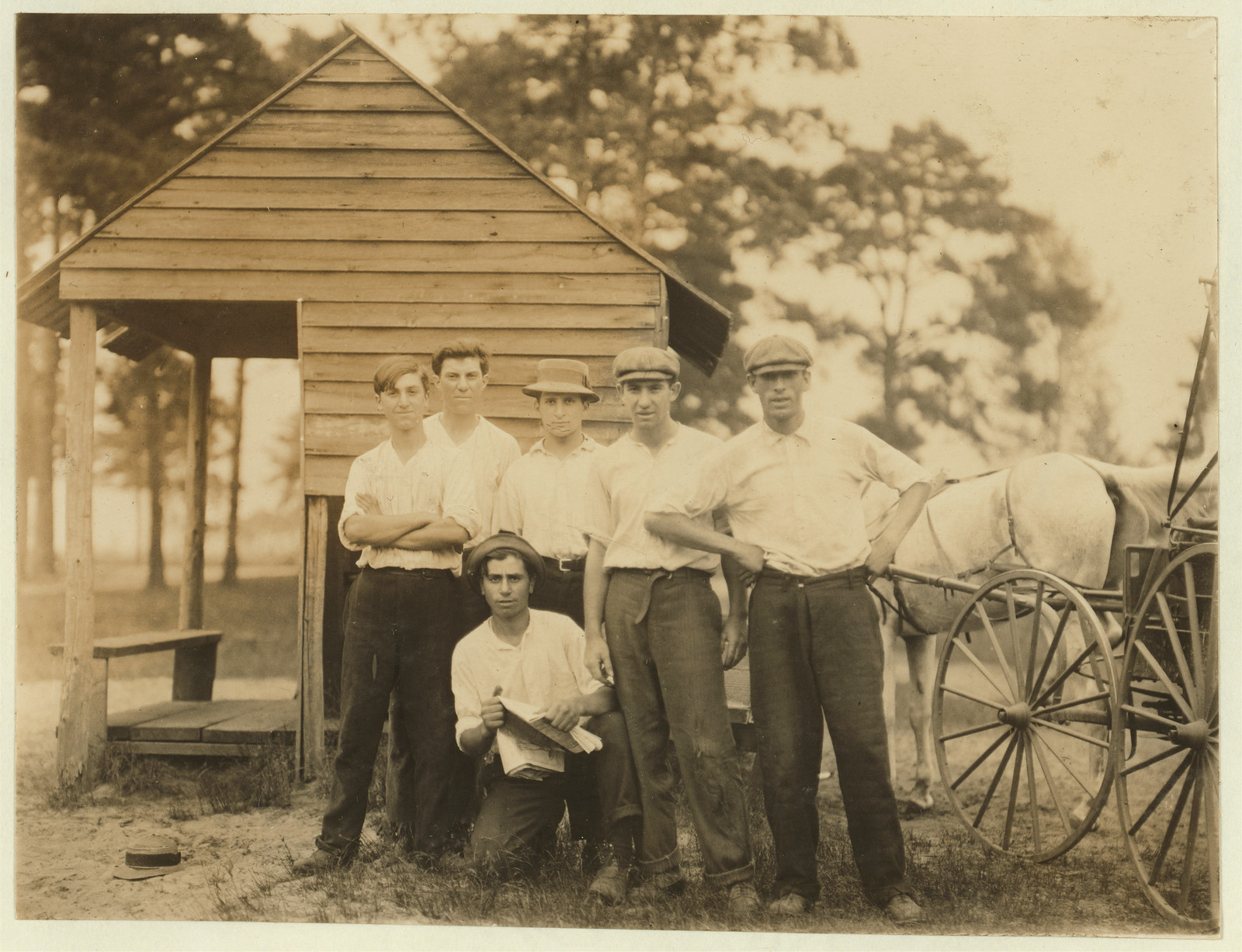 Gang of older boys working in White's Bog Brown Mills, N.J. Cranberry bogs, a rough gang. Sept. 28, 1910. Witness, E. F. Brown,. Location: Browns Mills, New Jersey / Photo by Lewis W. Hine., 1910 September 28. — historic image