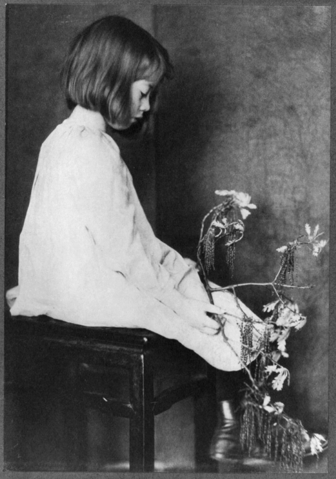 Child with oak branch / EW., [ca. 1900] — historic photograph