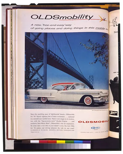 [Page of advertisement for Oldsmobile automobiles, showing a 1958 Oldsmobile and bridge]