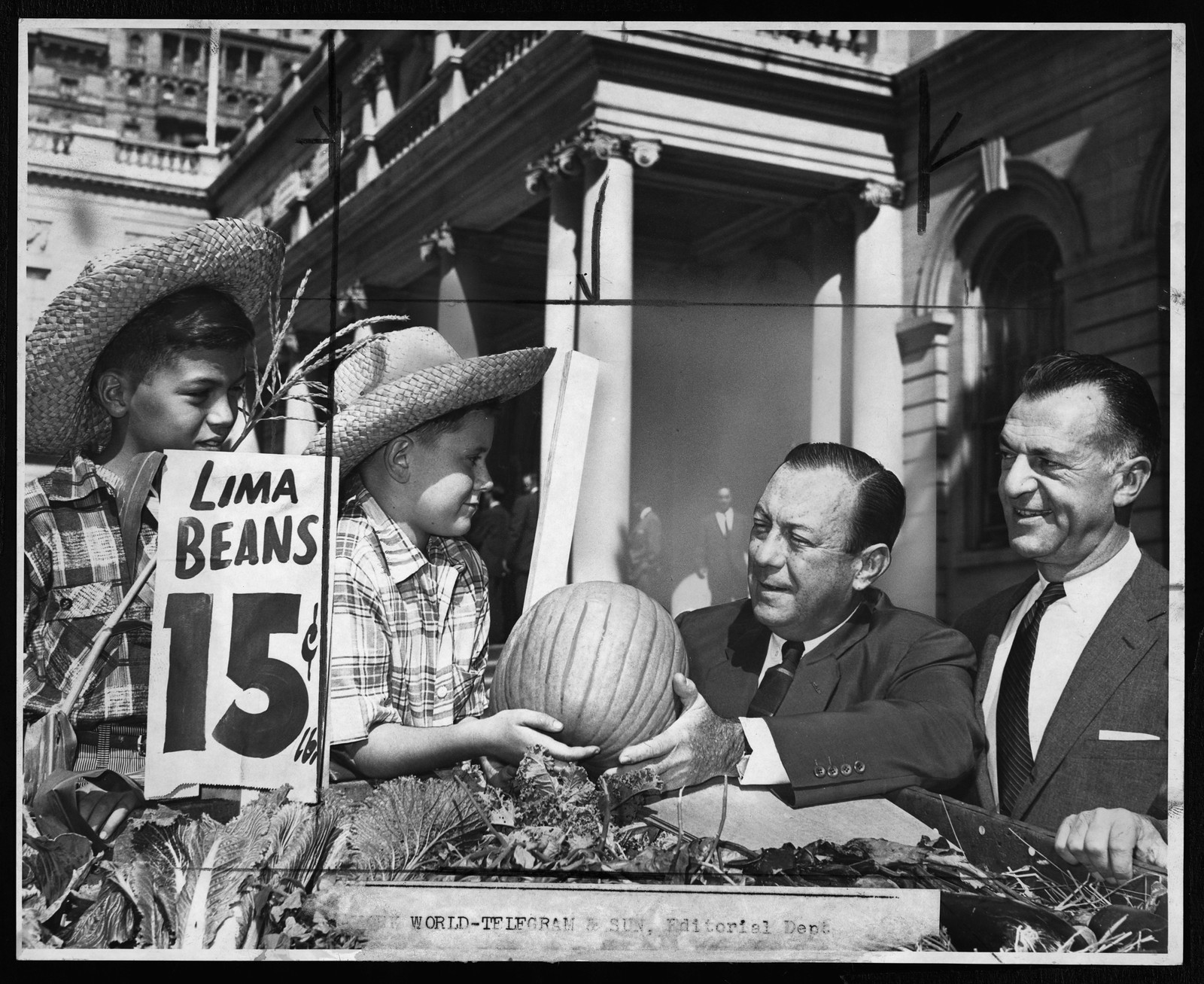 Boys in straw hats with lima beans sign and pumpkin — historic image