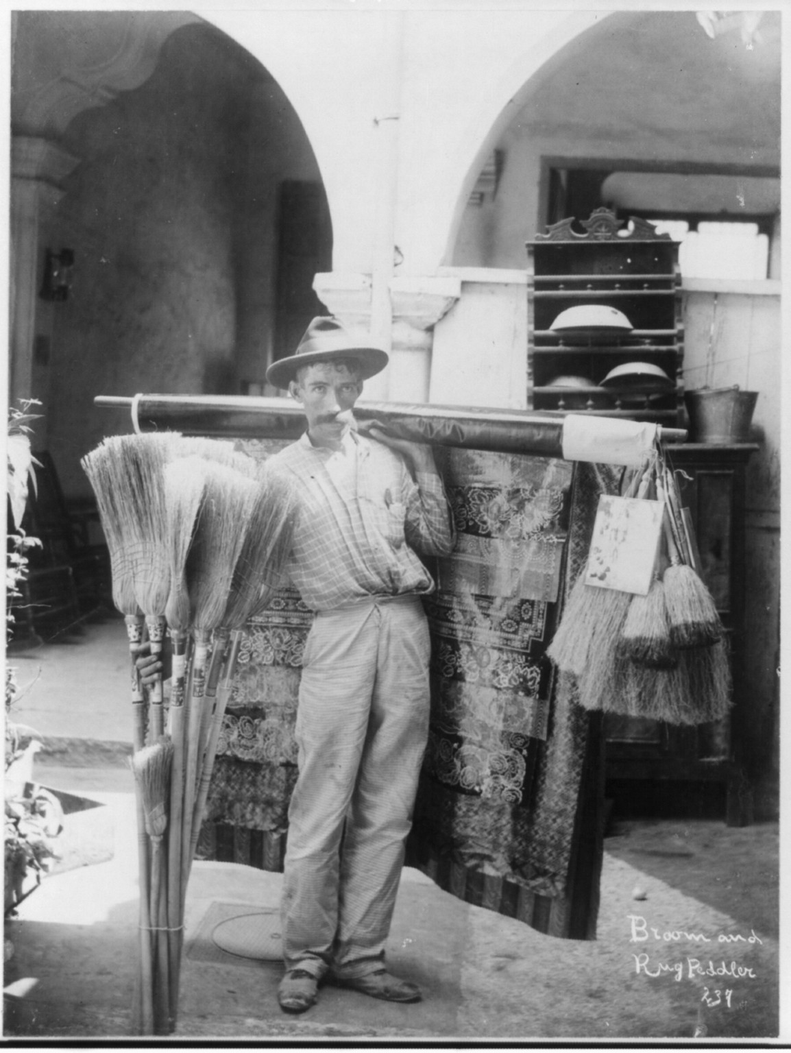 Broom and rug peddler, Cuba, [between 1895 and 1920] — historic photograph