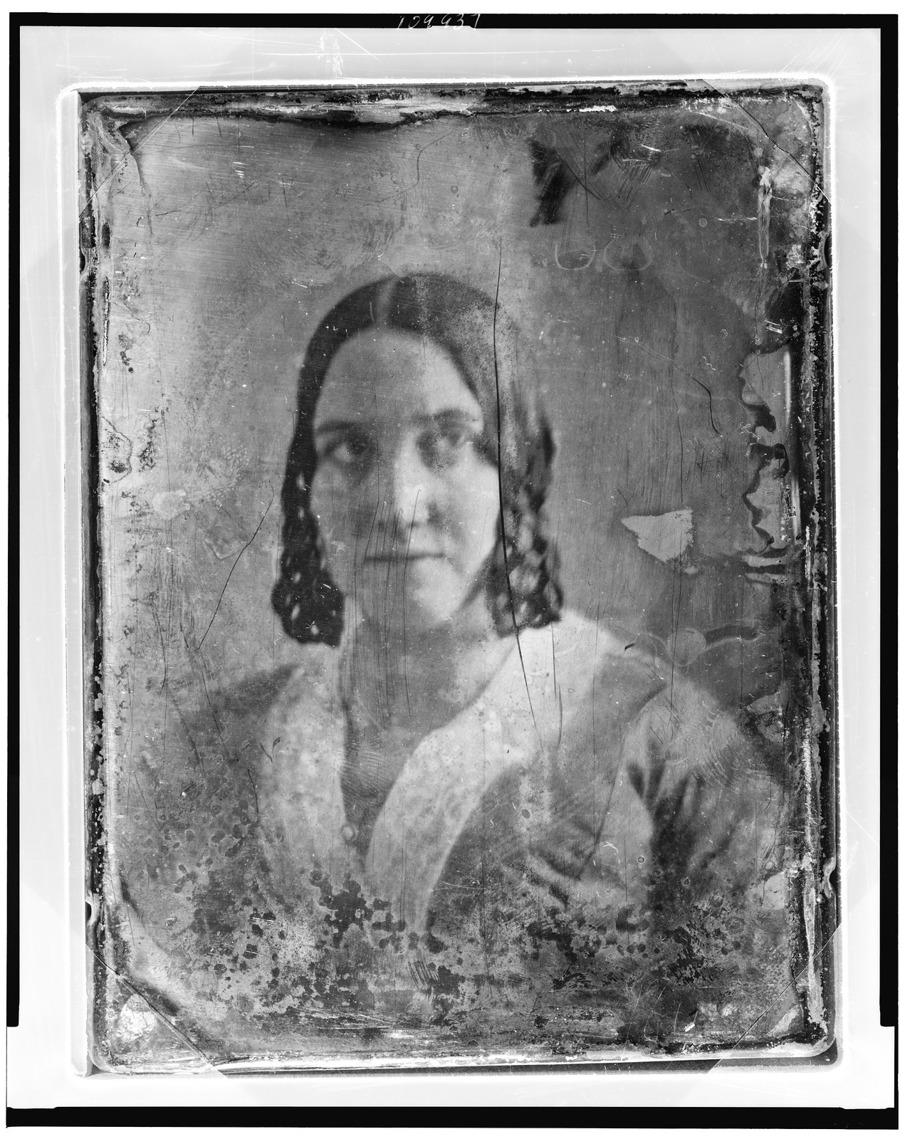 Daguerreotype portrait of a woman with dark hair, 1844 — historic photograph