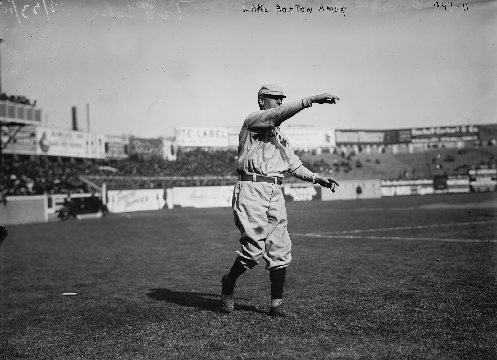 Cy Young, Boston AL, full-length portrait, standing, facing right, throwing baseball, c. 1908 — historic image