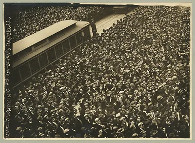 [Huge crowd of baseball fans watching baseball scoreboard during World Series game in New York City]