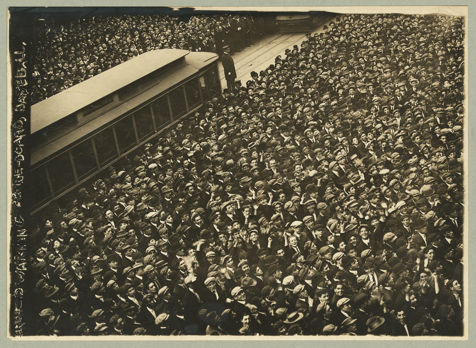 [Huge crowd of baseball fans watching baseball scoreboard during World Series game in New York City], [1911 Oct. 27] — historic photograph