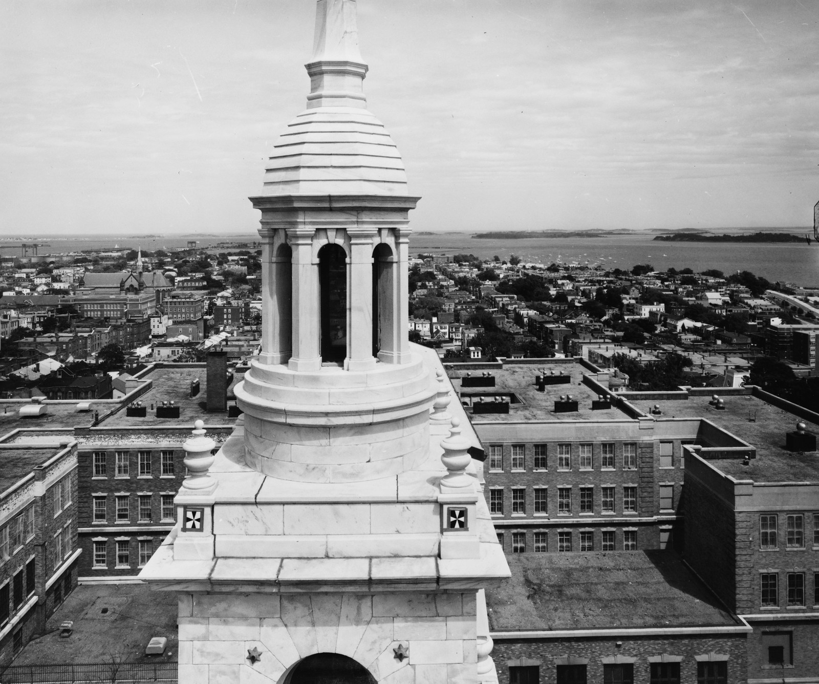 Marble cupola above city rooftops and harbor, black-and-white photograph — historic photograph