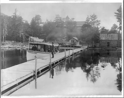 [Small steamboat TOWAHLOONDAH by pier on lake in the Adirondack Mtns., N.Y.]