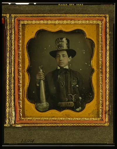 [Vigilant Fire Company, Baltimore, firefighter, half-length portrait, facing front, wearing parade hat and holding speaker trumpet]
