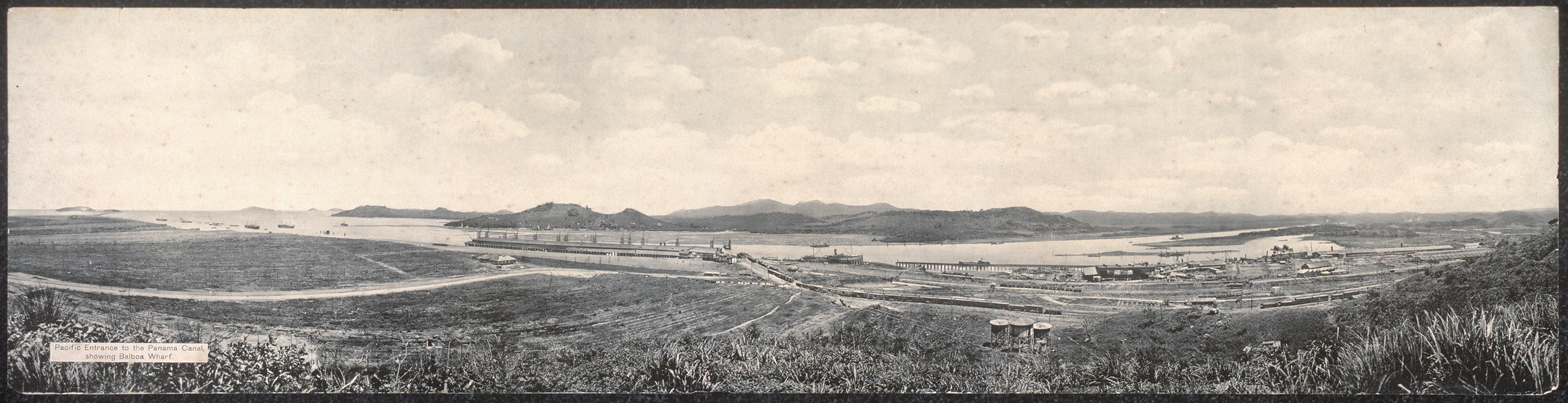 Panoramic view of harbor, hills and waterfront — historic image