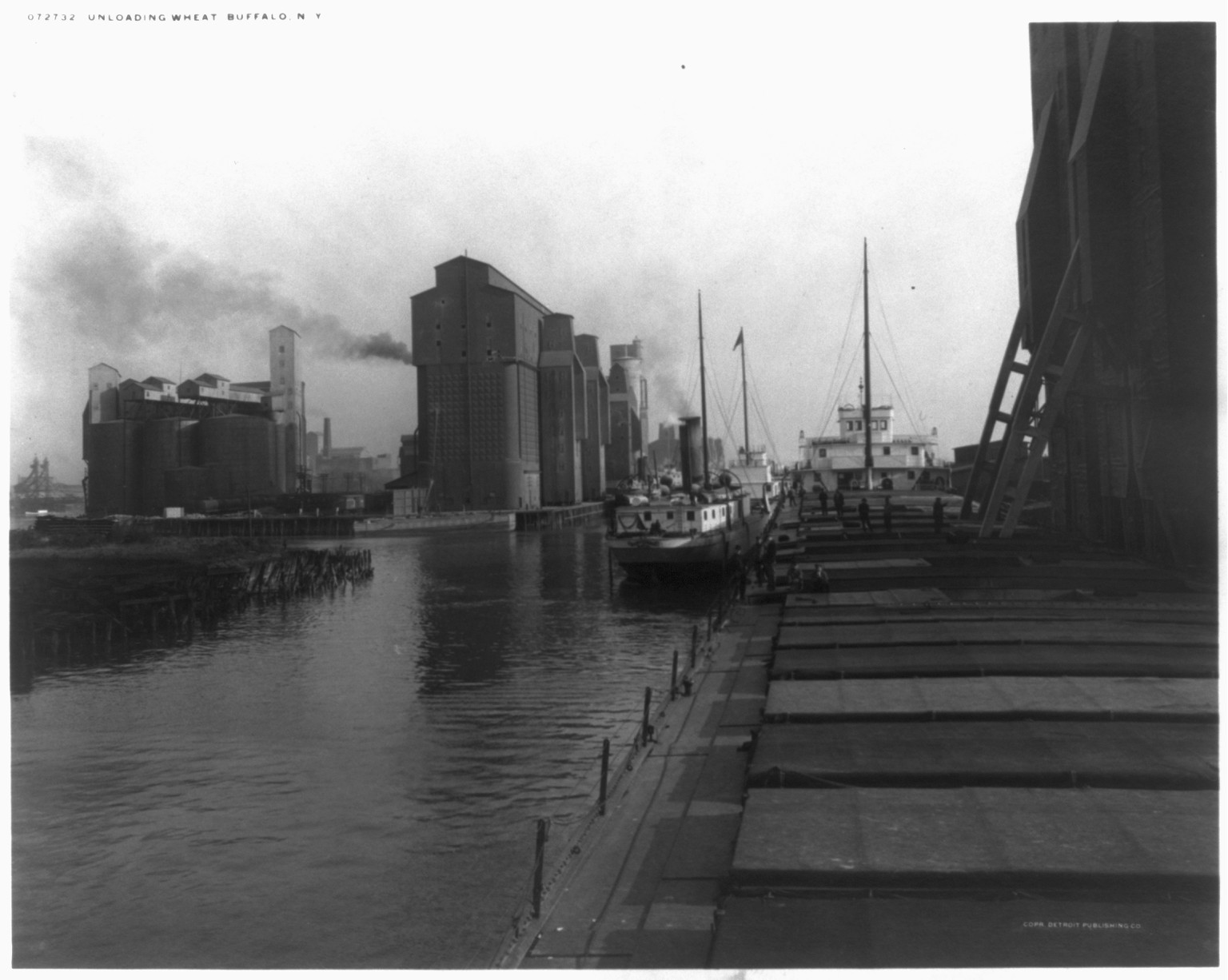 Unloading wheat [from steamboat], Buffalo, N.Y., c1912 April 4. — historic photograph