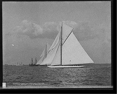 Shamrock II crossing finish line two seconds ahead of Columbia