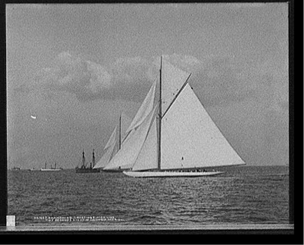 Shamrock II crossing finish line two seconds ahead of Columbia, 1901 Oct. 4. — historic photograph