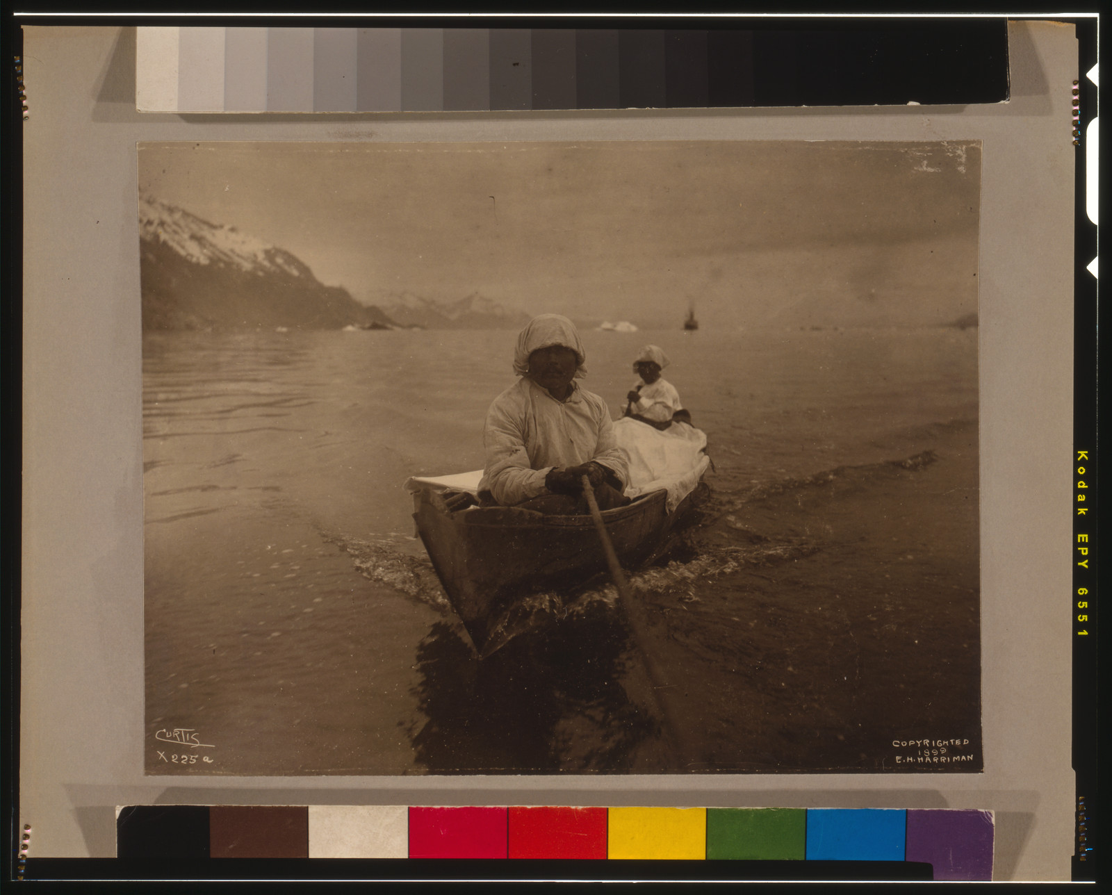 Seal hunters in canoe at Glacier Bay / Curtis., c1899. — historic photograph