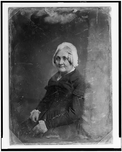 Unidentified woman in bonnet, half-length daguerreotype portrait