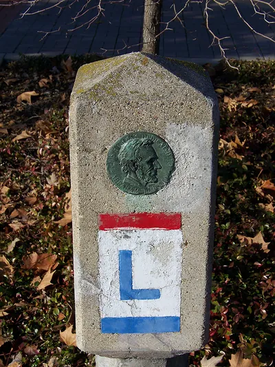 Lincoln Highway concrete marker with bronze Abraham Lincoln medallion