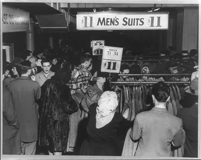 A huge crowd jamming a Boston department store early March 28, 1949, when men's suits and top coats went on sale for eleven dollars each