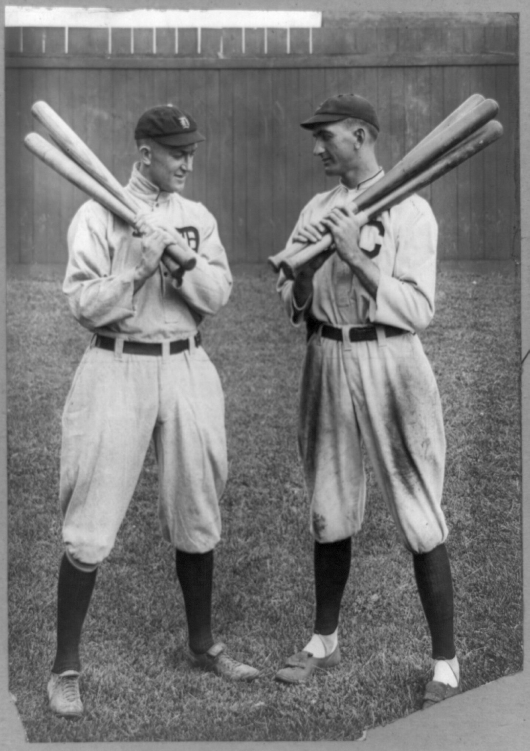 [Ty Cobb, Detroit, and Joe Jackson, Cleveland, standing alongside each other, each holding bats], c1913. — historic photograph