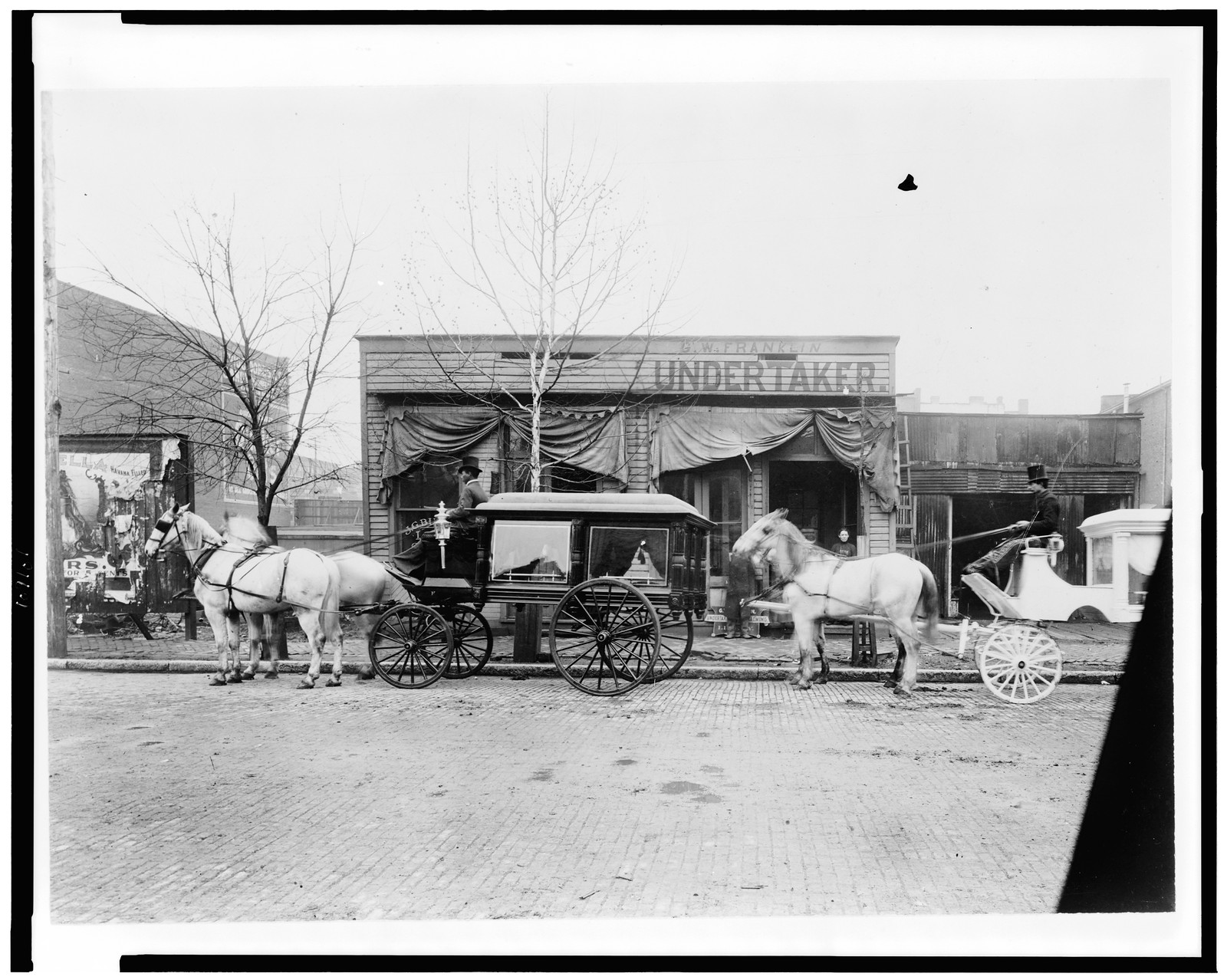 [Horses and carriages in front of funeral home of C.W. Franklin, undertaker, Chattanooga, Tennessee], [1899?] — historic photograph