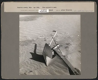 Plow covered by sand