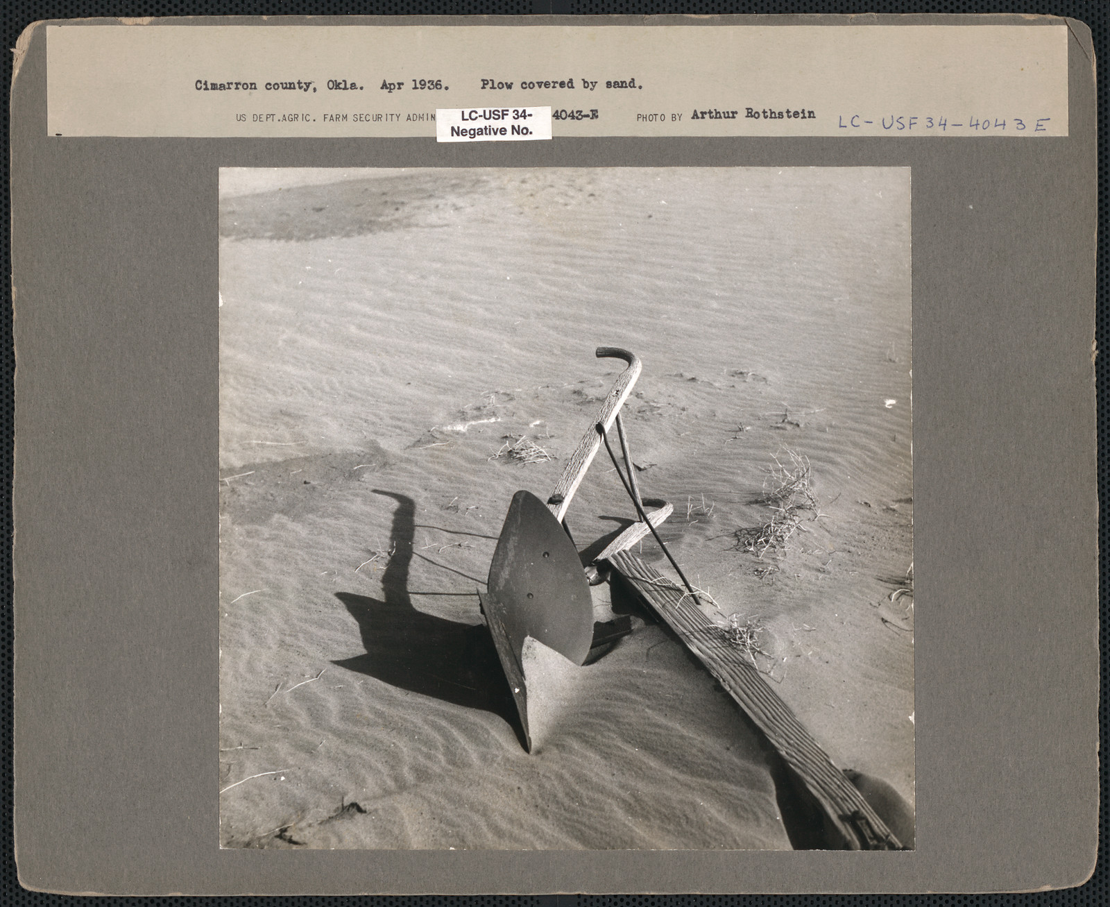 Plow covered by sand — historic image