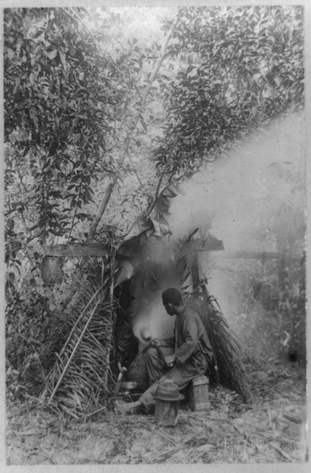 Smoking rubber, Brazil, [between ca. 1890 and 1923] — historic photograph