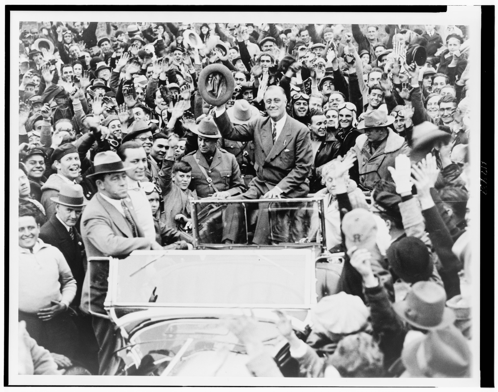 [Franklin D. Roosevelt, governor of New York, campaigning at Hyde Park, before a group of motorcyclists] — historic photograph
