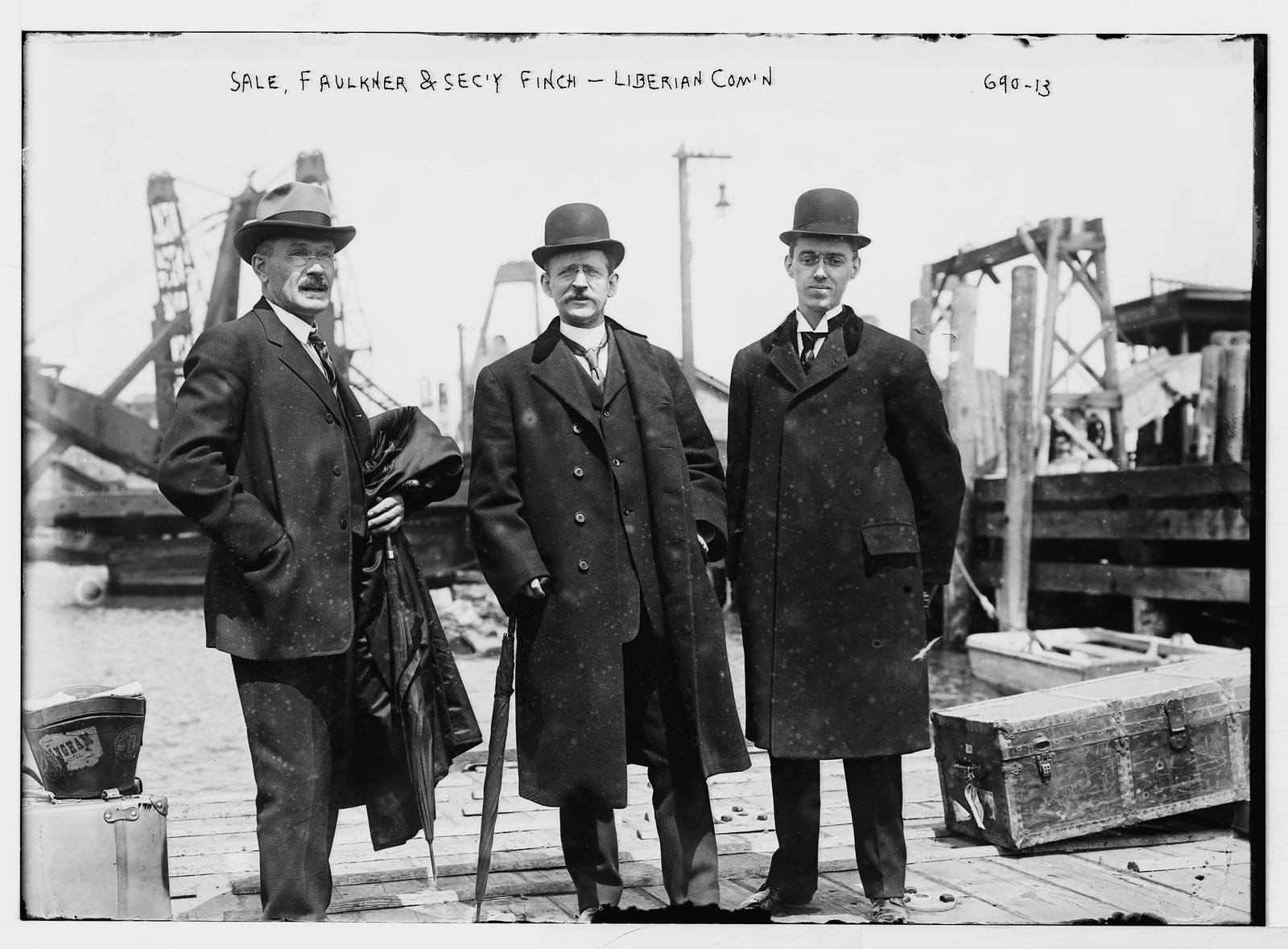 Liberian Commission at boat docks: Sale, Faulkner, and Finch, Sec'y, New York, 1909 — historic photograph