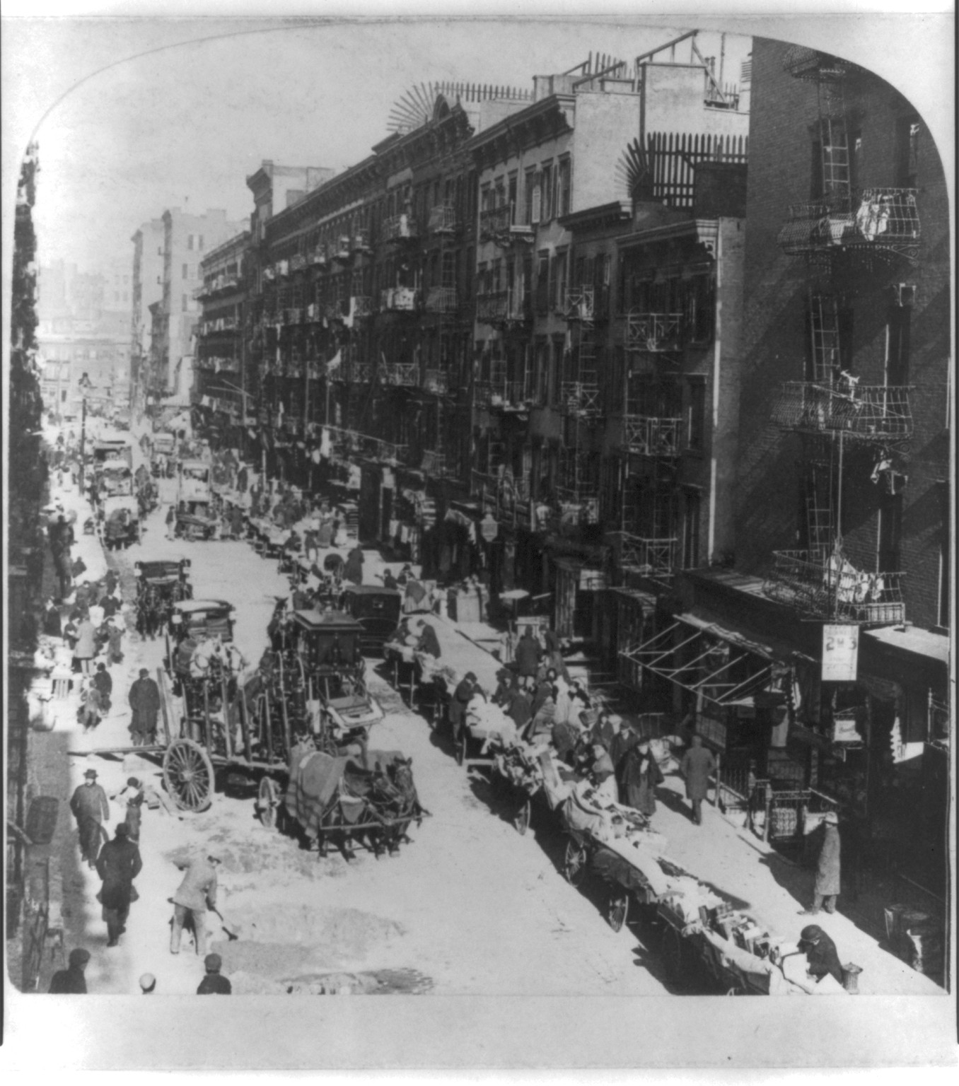 Street pedlars' carts on Elizabeth Street, looking north from Hester Street, New York City, U.S.A., New York : Underwood & Underwood, publishers, c1902. — historic photograph