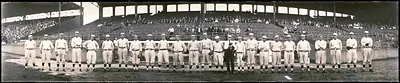 Baseball team lined up before grandstand, panoramic photograph