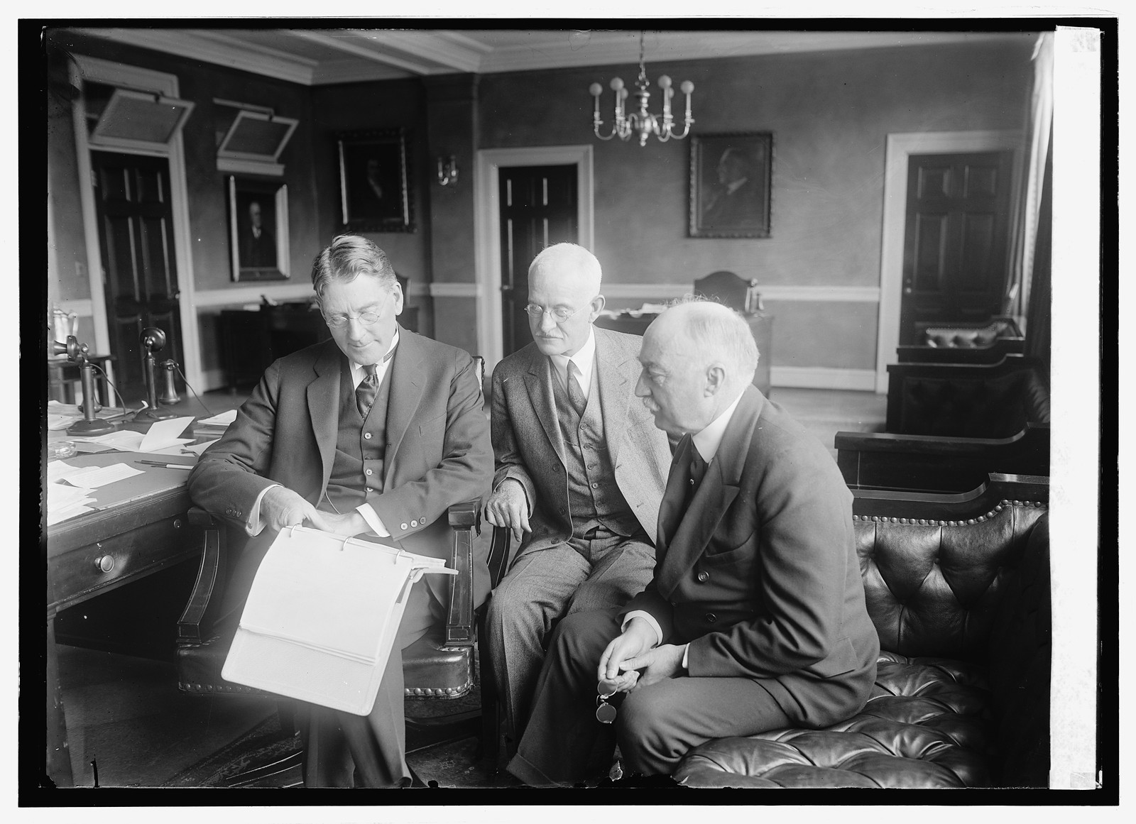 Sec. Wilburn, Capt. W.R. Sefton, Rear Adm. Straus, budget officers, 9/20/24, [19]24 September 20. — historic photograph