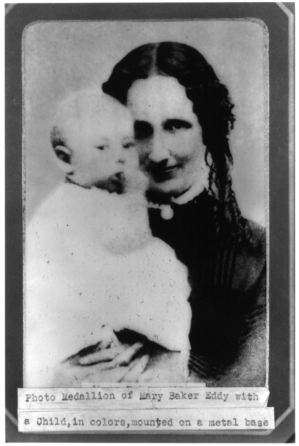 Mary Baker Eddy holding child, [no date recorded on caption card] — historic photograph