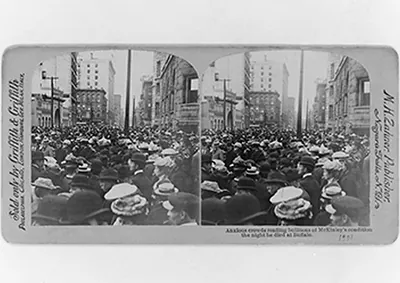 Anxious crowds reading bullitens[sic] of McKinley's condition the night he died at Buffalo