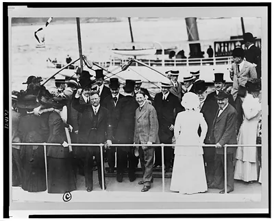 Roosevelt after leaving line, greeting newspapermen